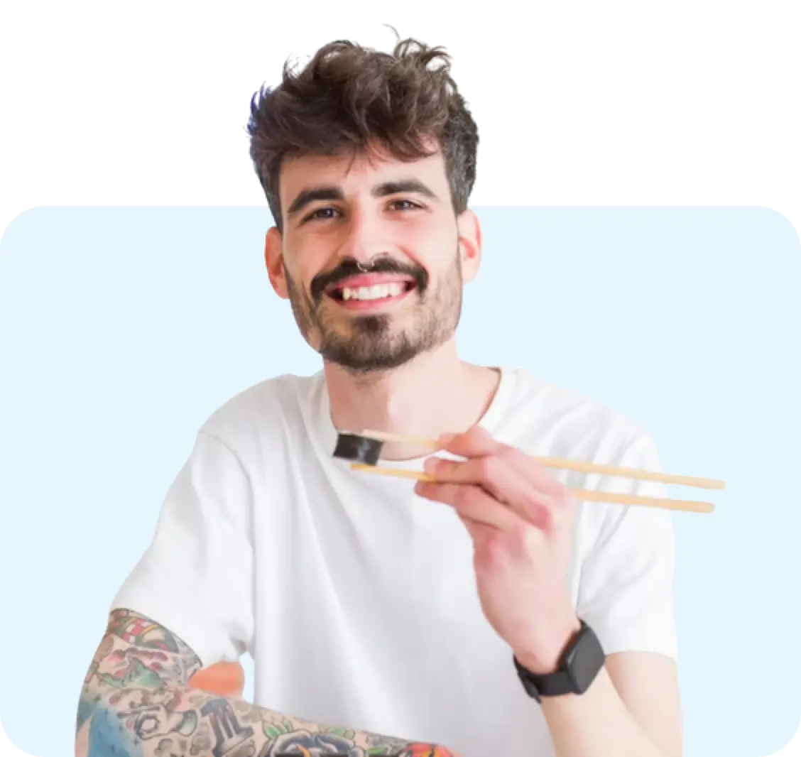 Man eating a sushi roll